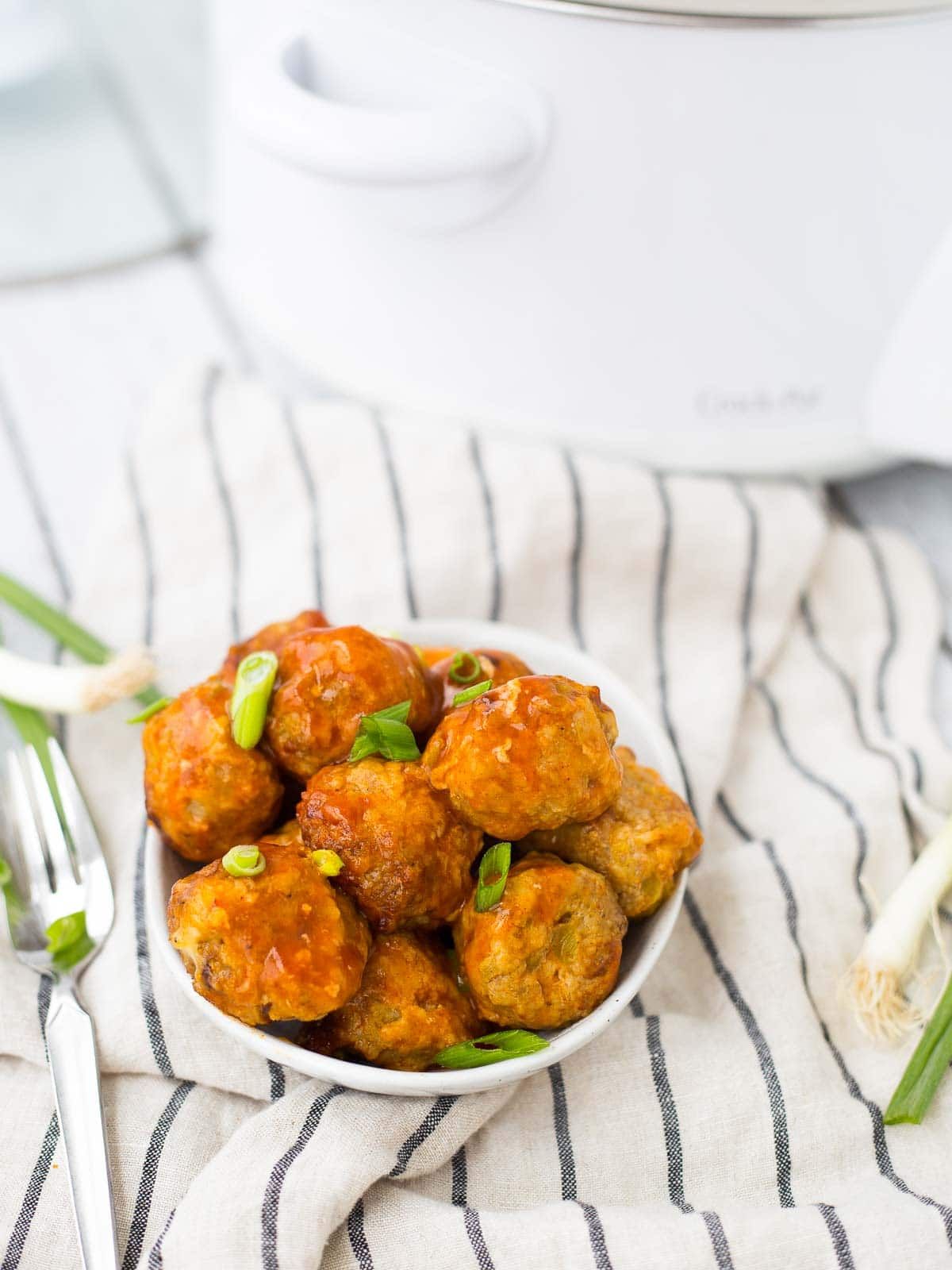 Perfect for parties or a busy weeknight, these turkey enchilada slow cooker meatballs are easy to make, healthy, and so flavorful!