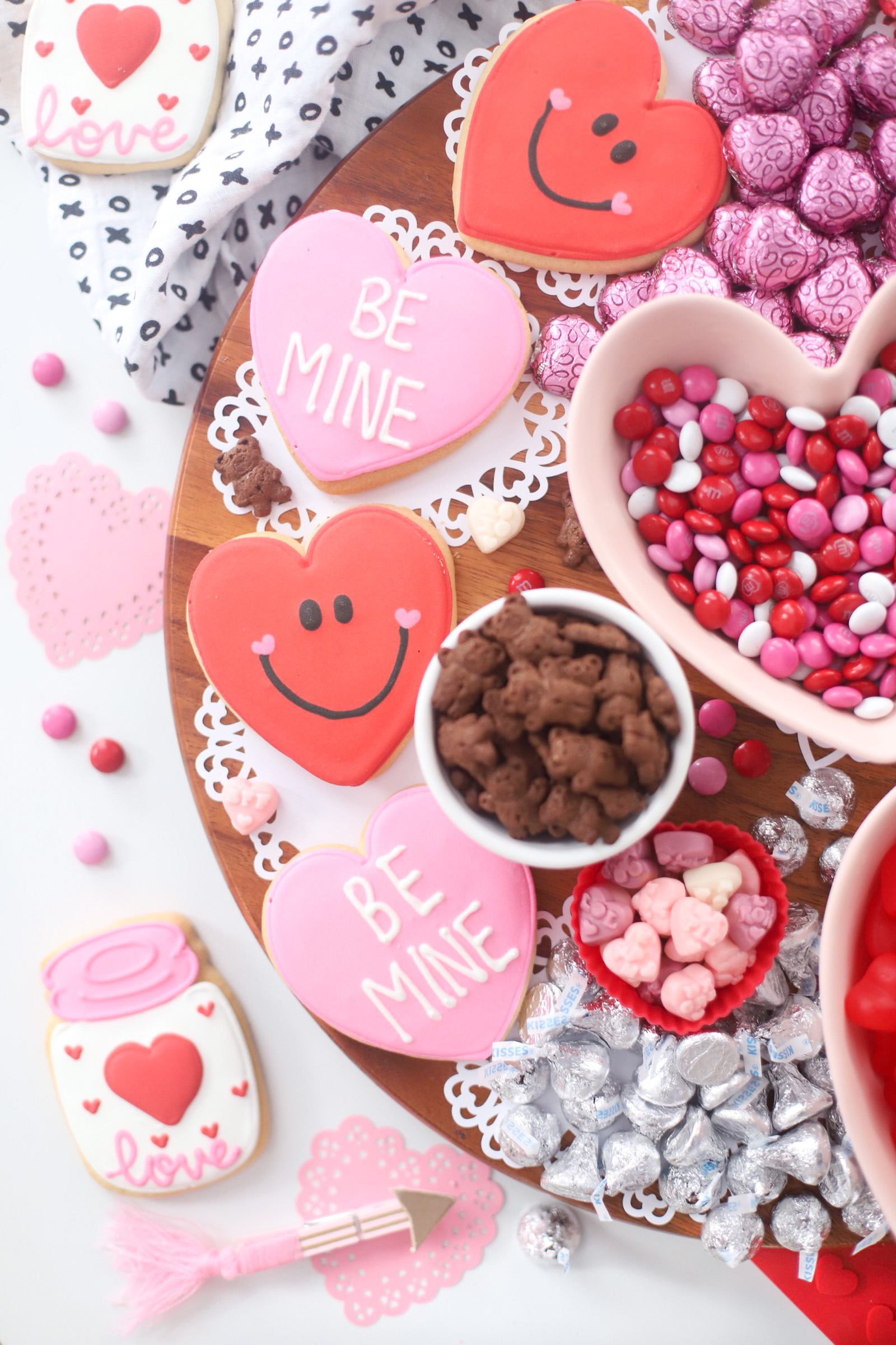 The Valentine’s Day dessert board is a spin on the traditional charcuterie, only this spread features nothing but dessert! Piled high with chocolates, candies, and cookies, this is the dessert spread of your sweet tooth dreams. No cooking required! | @glitterinclexi | GLITTERINC.COM