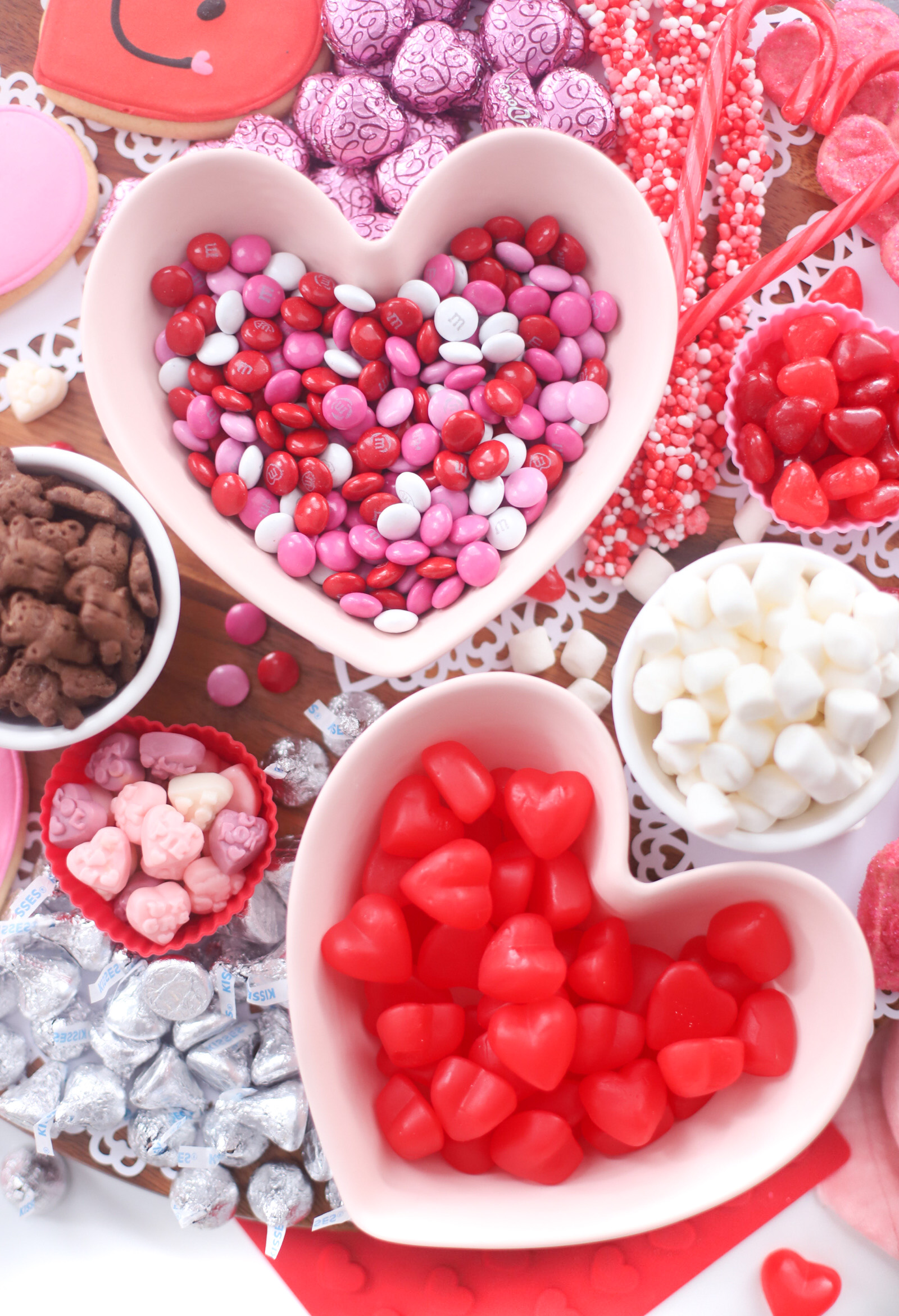 The Valentine’s Day dessert board is a spin on the traditional charcuterie, only this spread features nothing but dessert! Piled high with chocolates, candies, and cookies, this is the dessert spread of your sweet tooth dreams. No cooking required! | @glitterinclexi | GLITTERINC.COM