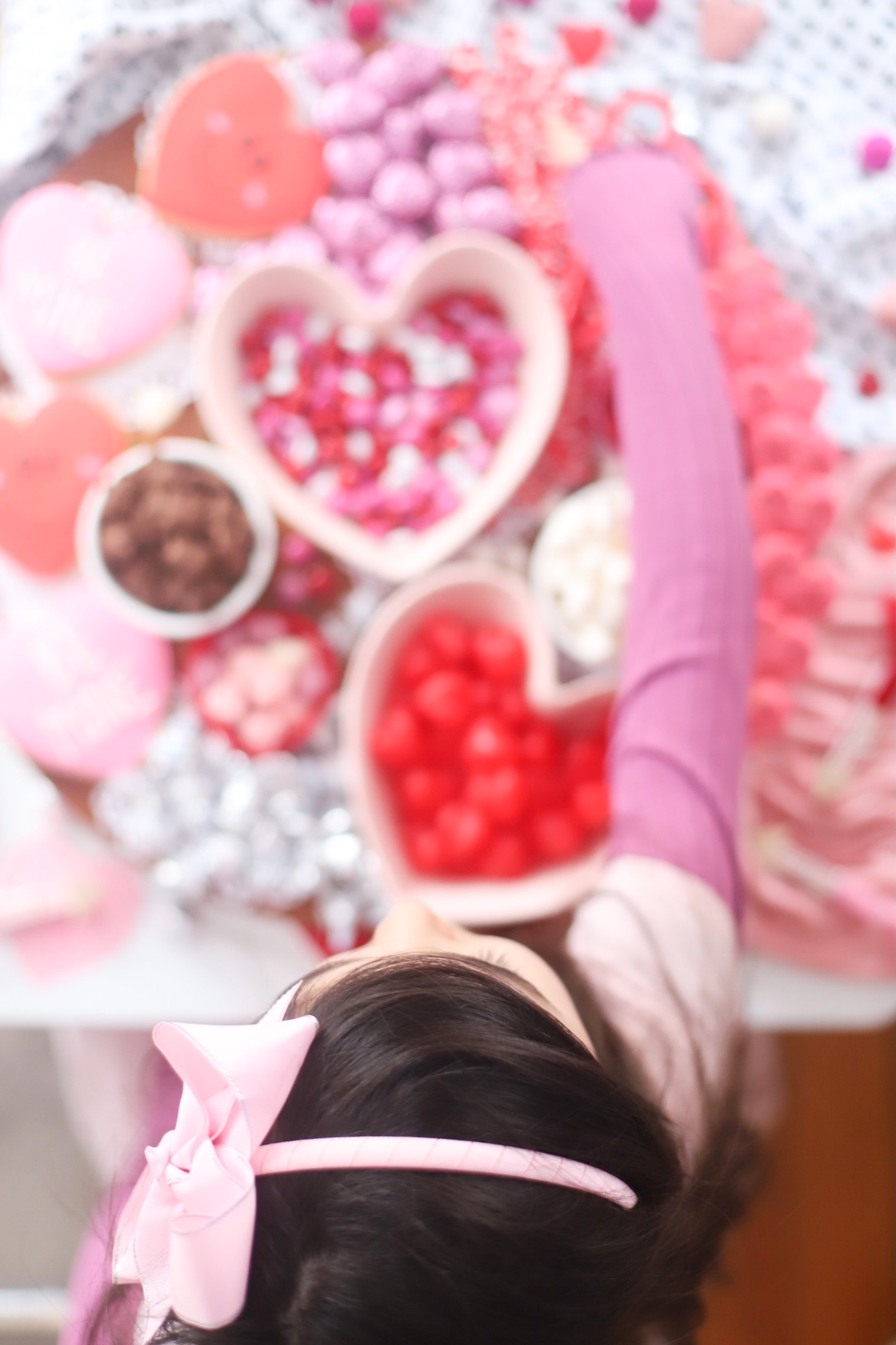 The Valentine’s Day dessert board is a spin on the traditional charcuterie, only this spread features nothing but dessert! Piled high with chocolates, candies, and cookies, this is the dessert spread of your sweet tooth dreams. No cooking required! | @glitterinclexi | GLITTERINC.COM