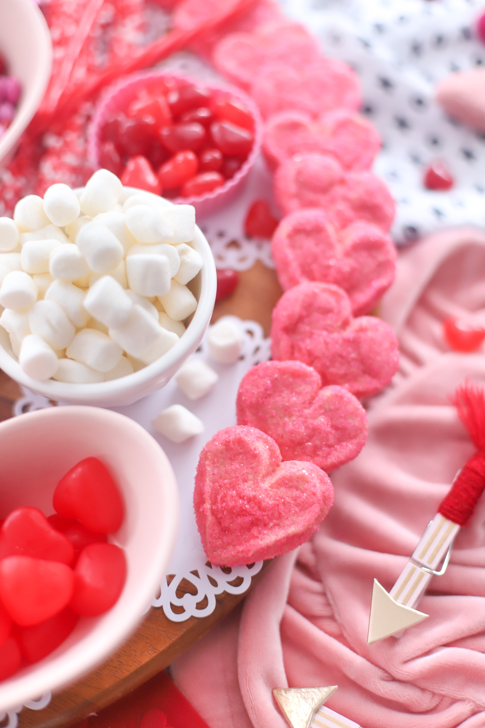 The Valentine’s Day dessert board is a spin on the traditional charcuterie, only this spread features nothing but dessert! Piled high with chocolates, candies, and cookies, this is the dessert spread of your sweet tooth dreams. No cooking required! | @glitterinclexi | GLITTERINC.COM