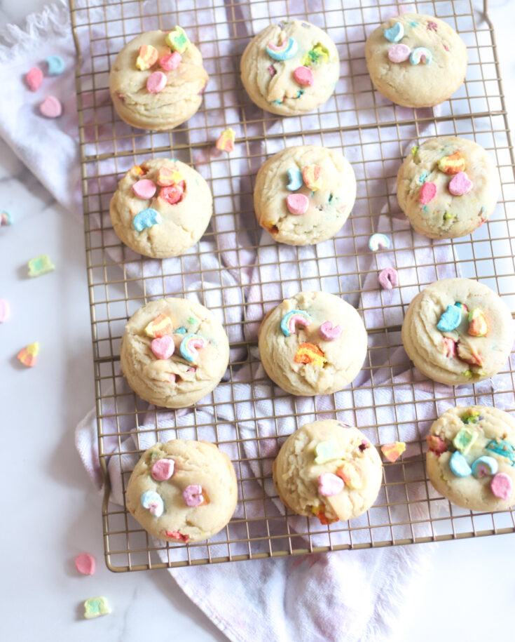 Bake up a big batch of these pillowy soft dairy free sugar cookies, filled and topped with Lucky Charms marshmallows for a festive St. Patrick’s Day treat! GLITTERINC.COM