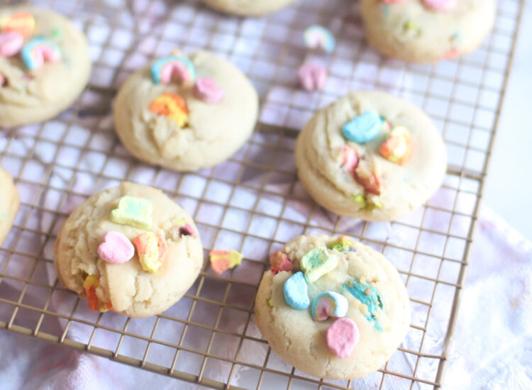The best and most unbelievably perfect dairy free sugar cookies, filled and topped with Lucky Charms marshmallows, plus a soft, thick, and chewy interior; these festive pillowy sugar cookies are a deliciously adorable recipe for a St. Patrick’s Day treat. | @glitterinclexi | GLITTERINC.COM