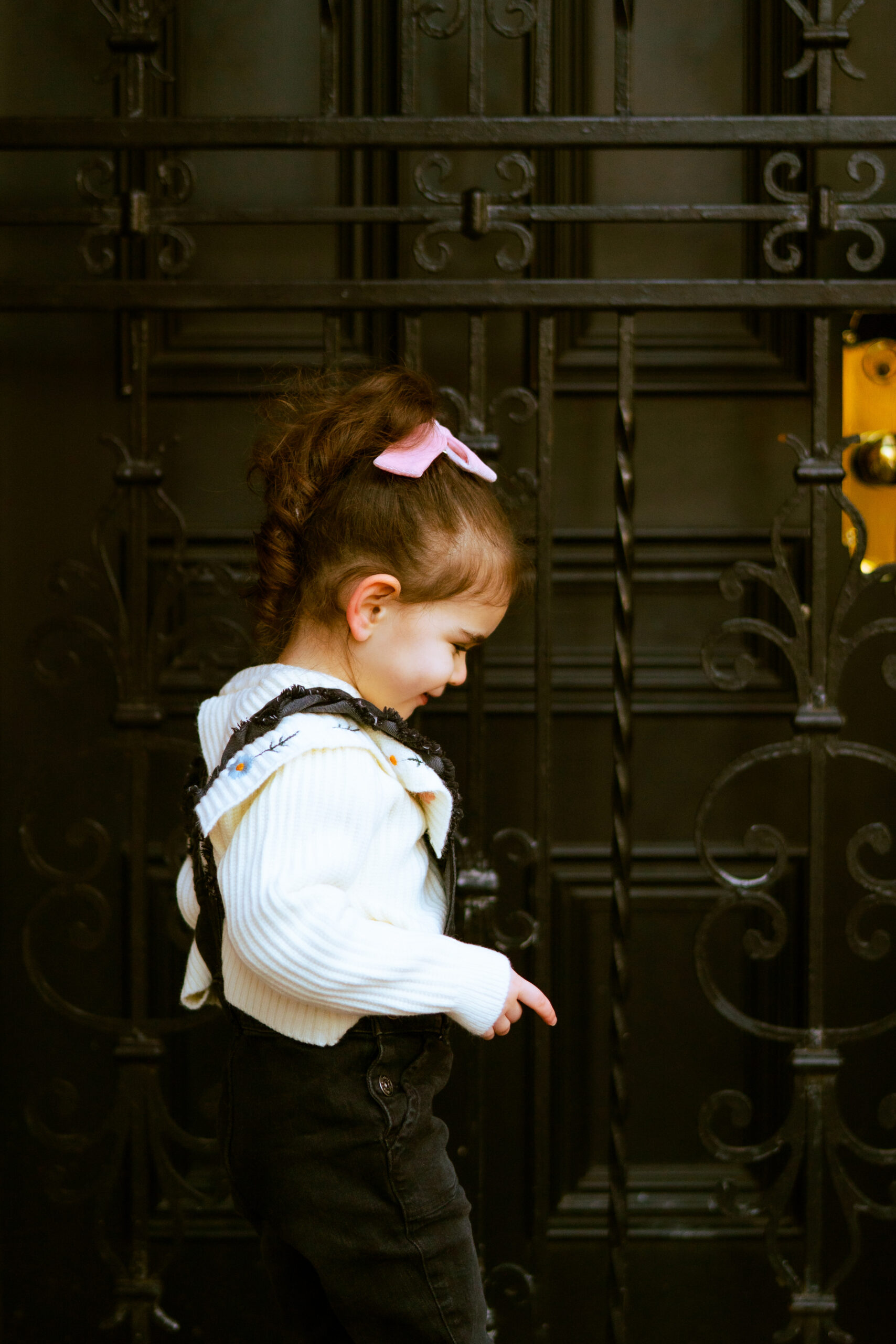 a little girl outside showing the way Living in a Big City With Young Kids