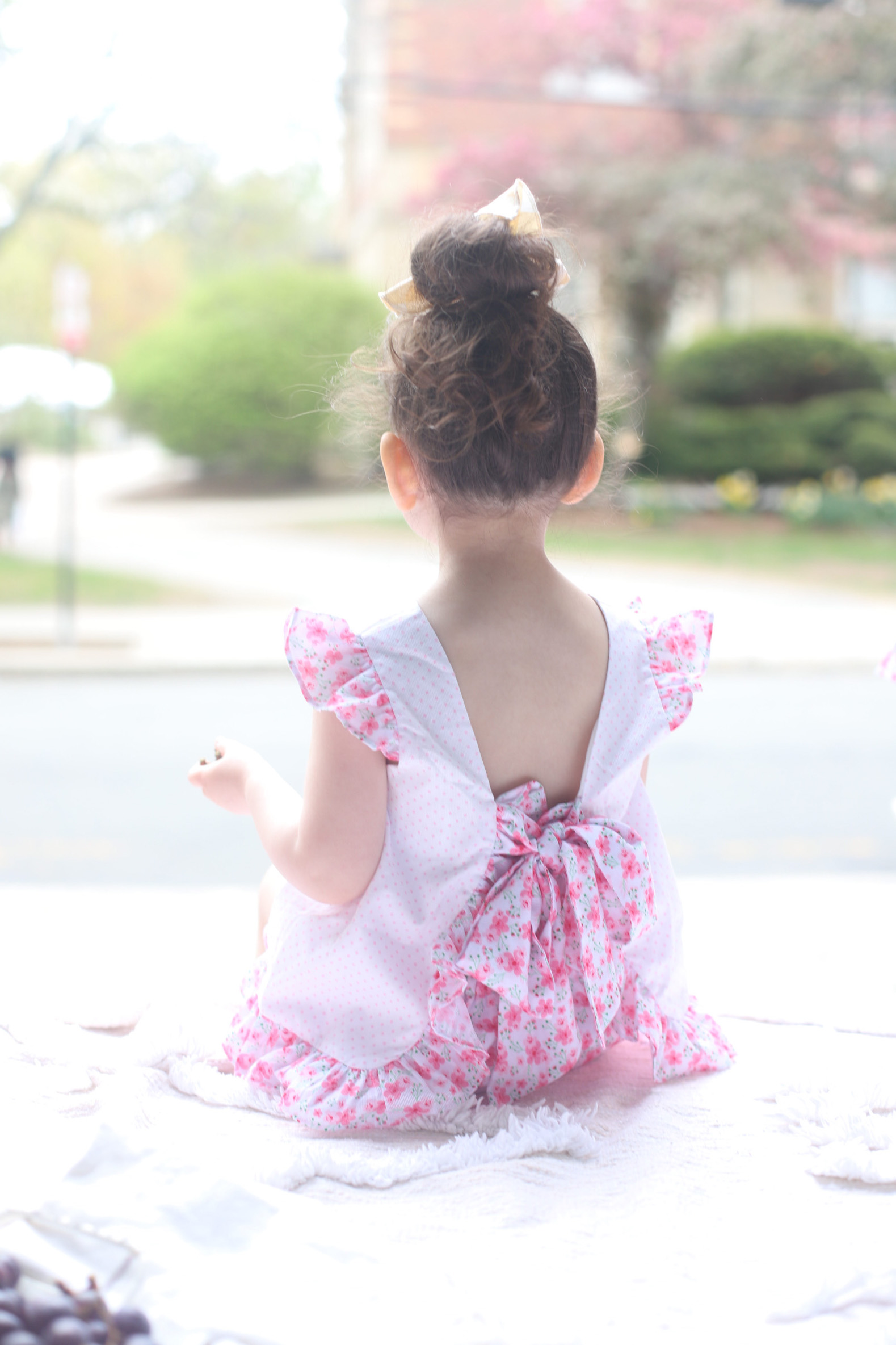 a back of a kid facing the streets