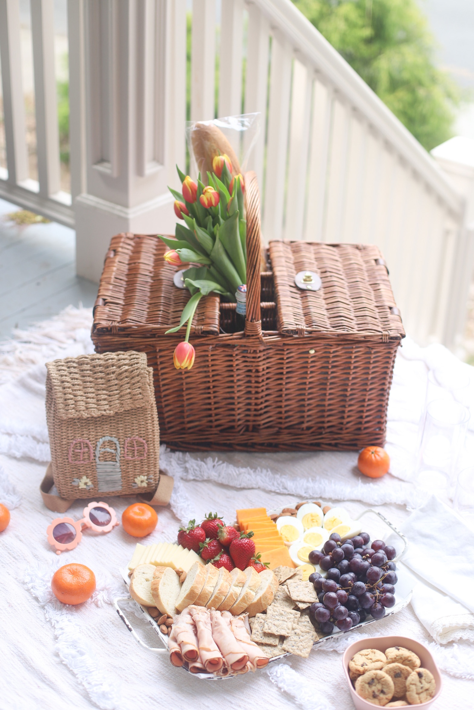 a picnic basket and a charcuterie board