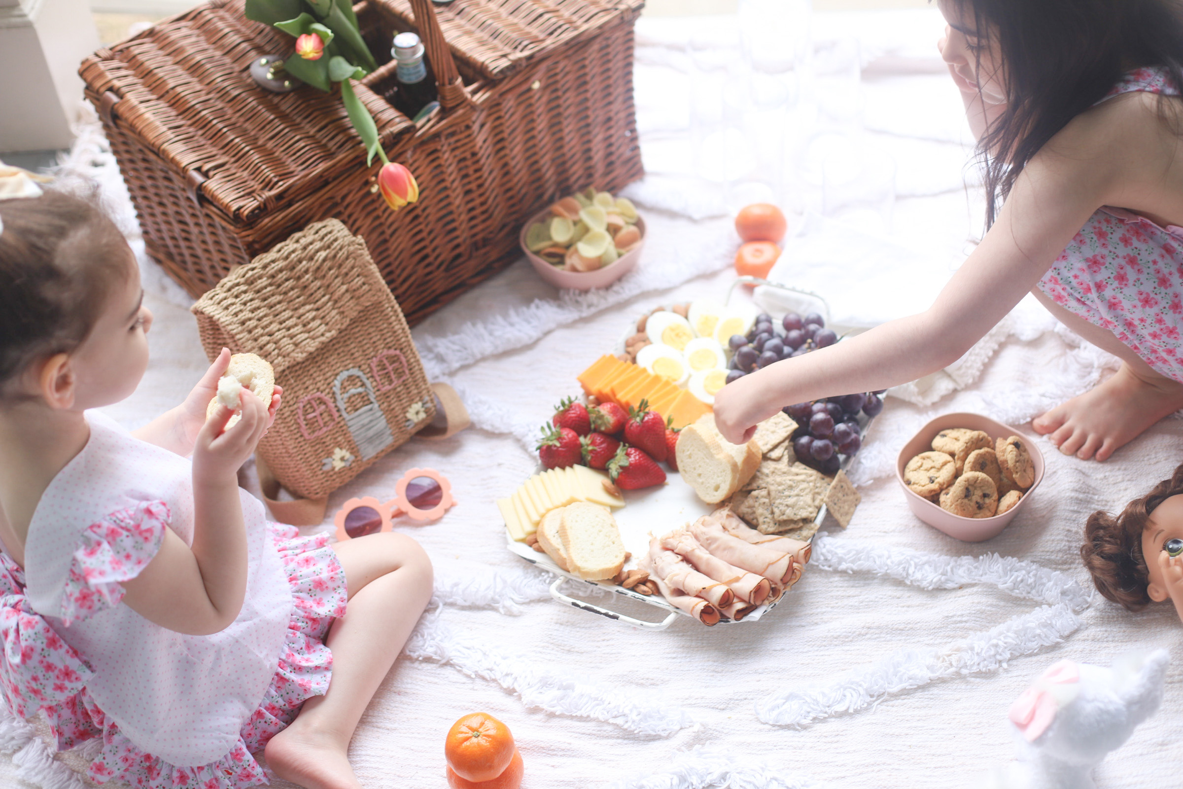 two kids having a picnic at the porch