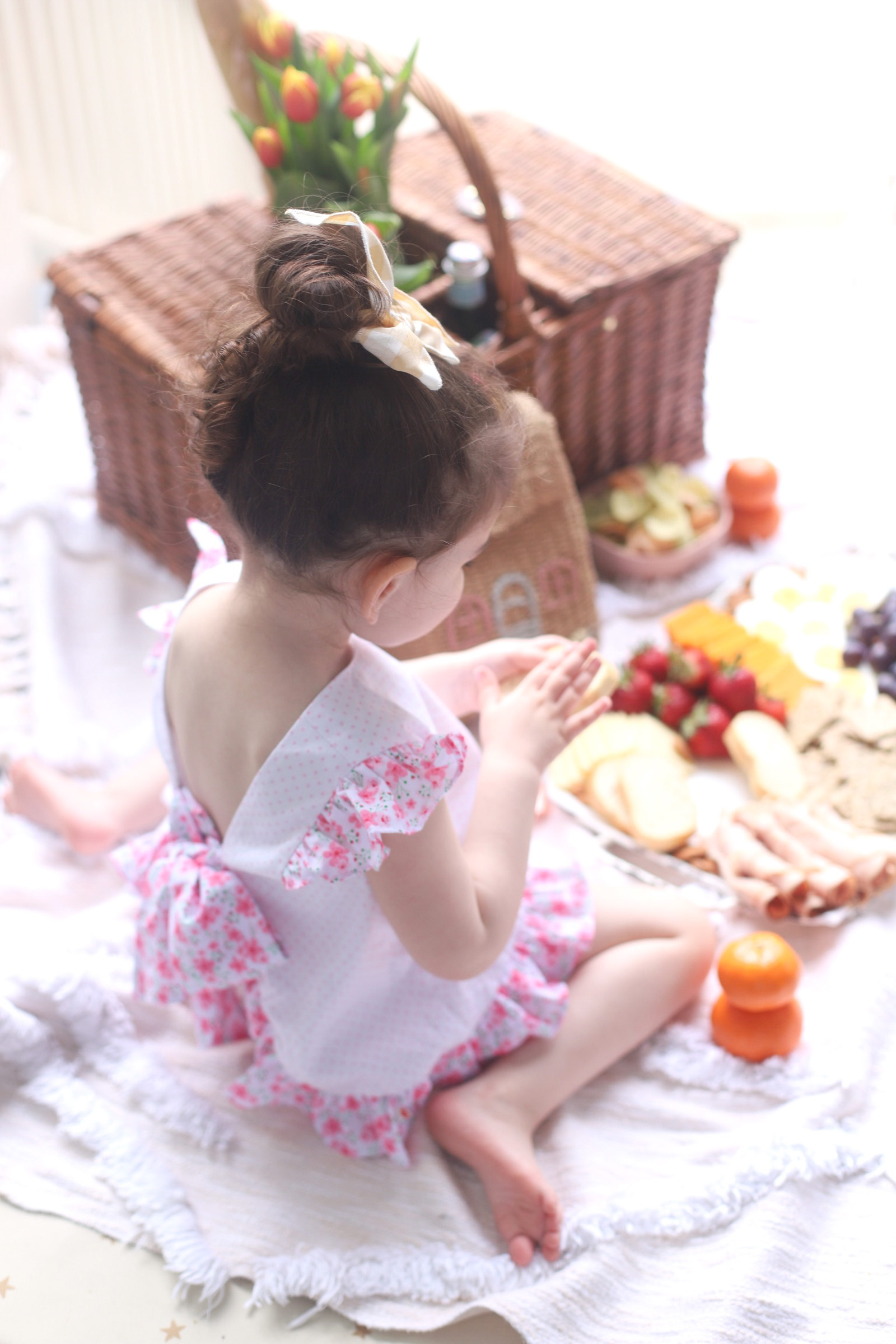 a kid eating from a charcuterie board 