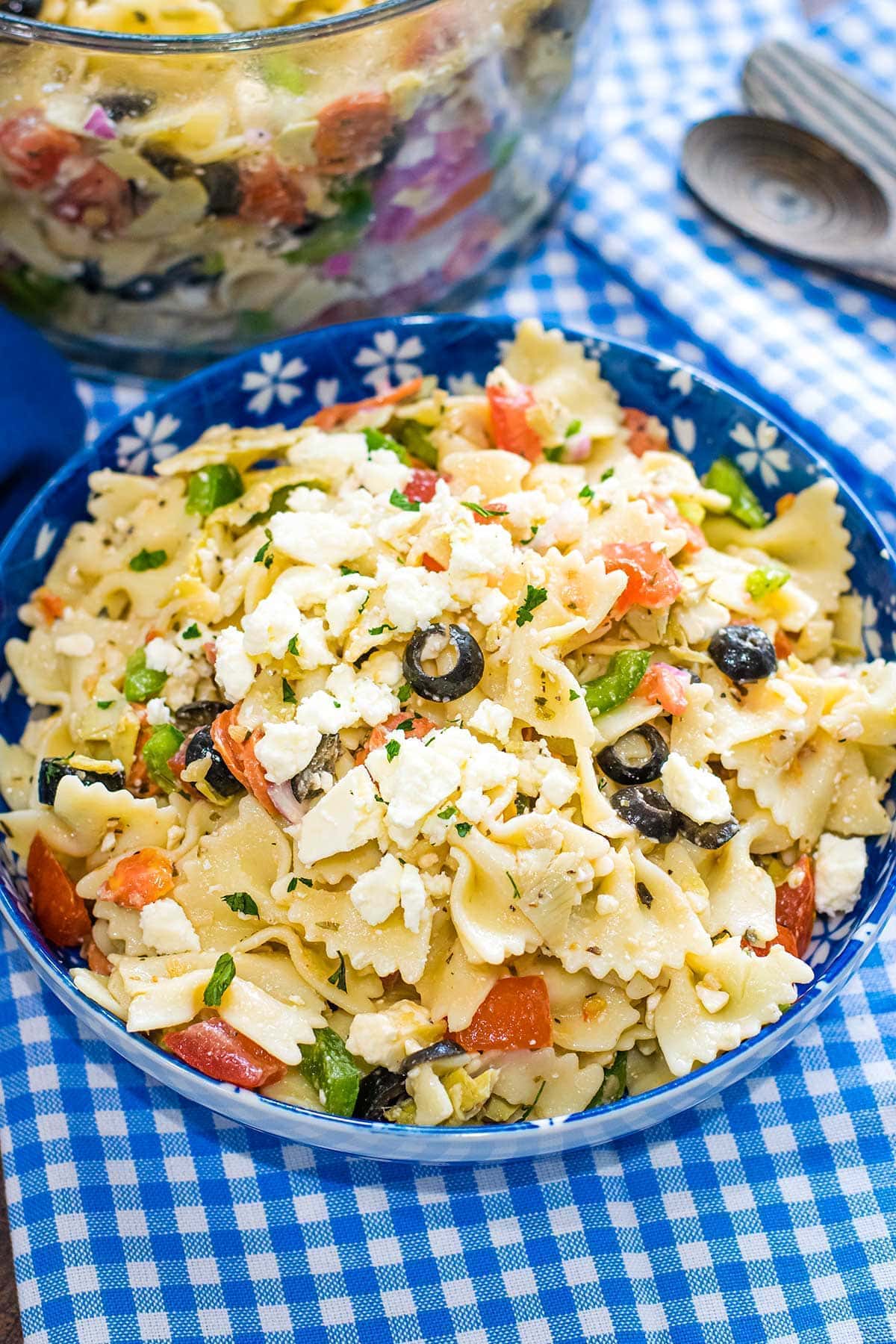 Pasta Salad with Artichoke Hearts and Feta on a blue bowl