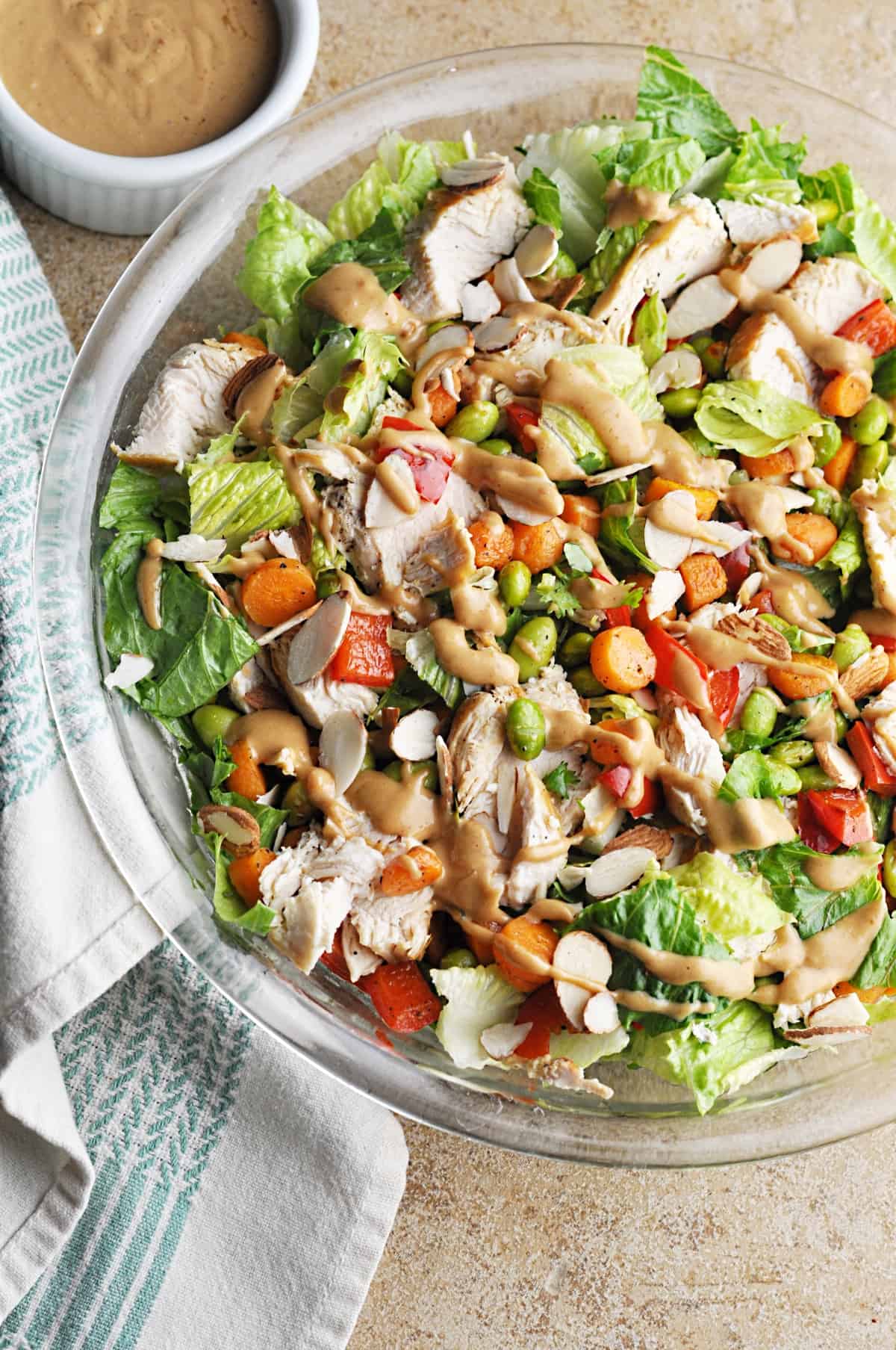 Copycat Panera Spicy Thai salad with Chicken served on a clear salad bowl