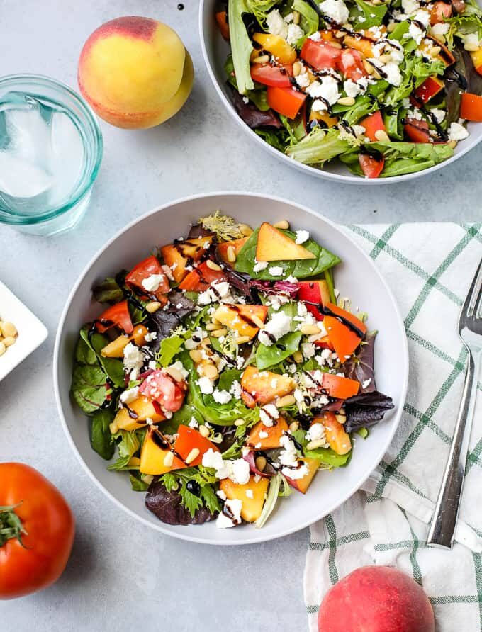 Peach Salad with Feta and Pine Nuts on white plate for Incredible Summer Salad Recipes