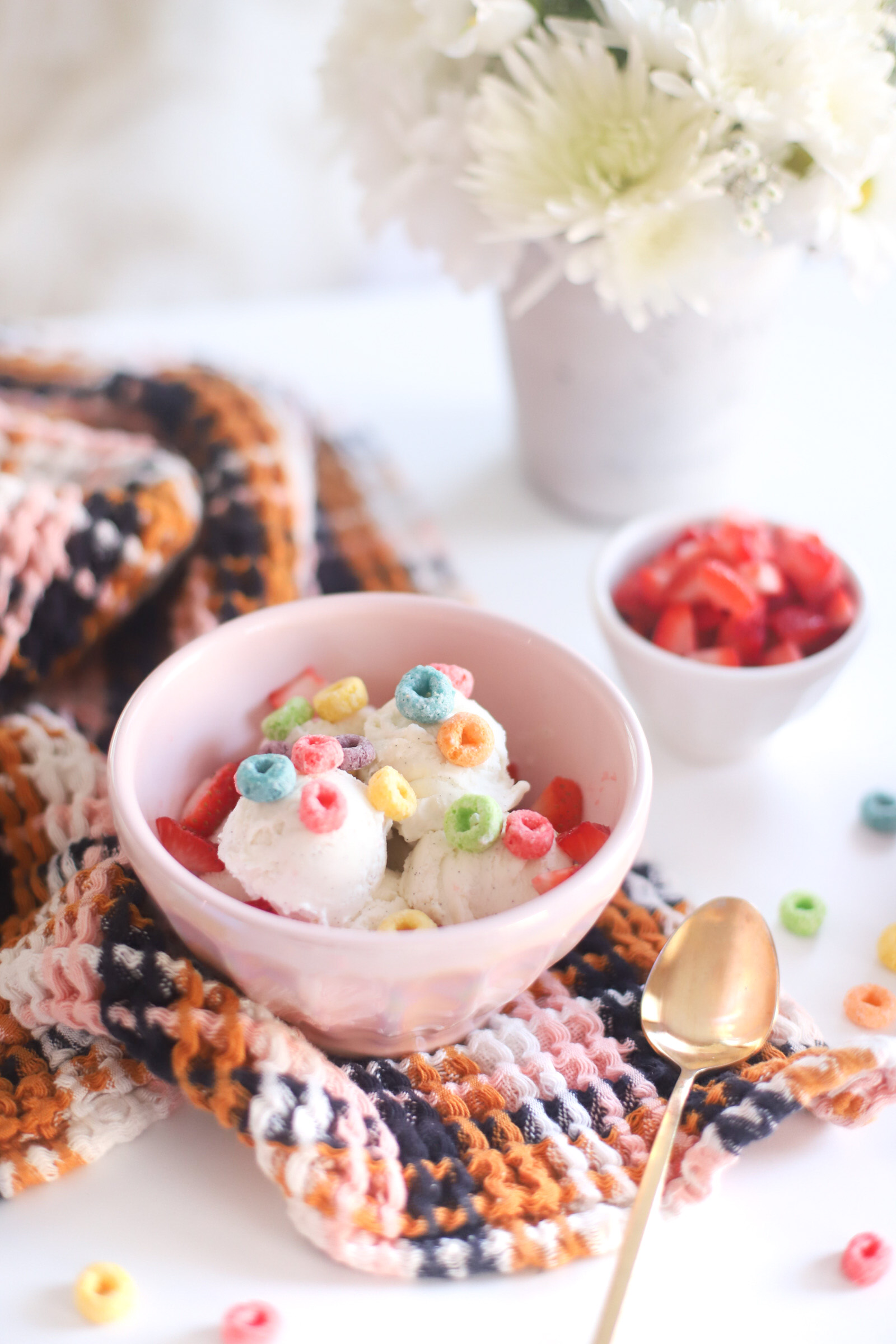 ice cream on a bowl with cereal and berry toppings 