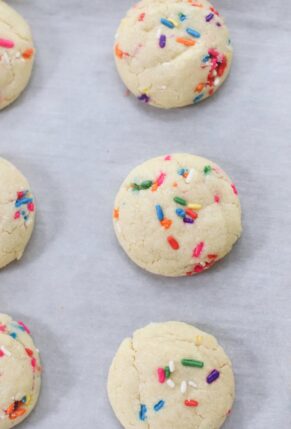 The softest sugar cookies with that perfect chewy center, packed with sprinkles; say hello to our very favorite dairy free sprinkle cookies! These pillowy soft cookies will quickly become your new favorite sugar cookie recipe! | @glitterinclexi | GLITTERINC.COM