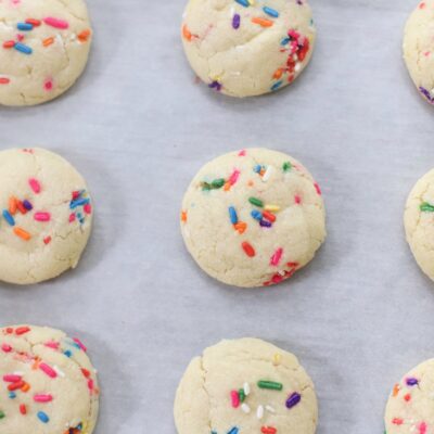 The softest sugar cookies with that perfect chewy center, packed with sprinkles; say hello to our very favorite dairy free sprinkle cookies! These pillowy soft cookies will quickly become your new favorite sugar cookie recipe! | @glitterinclexi | GLITTERINC.COM