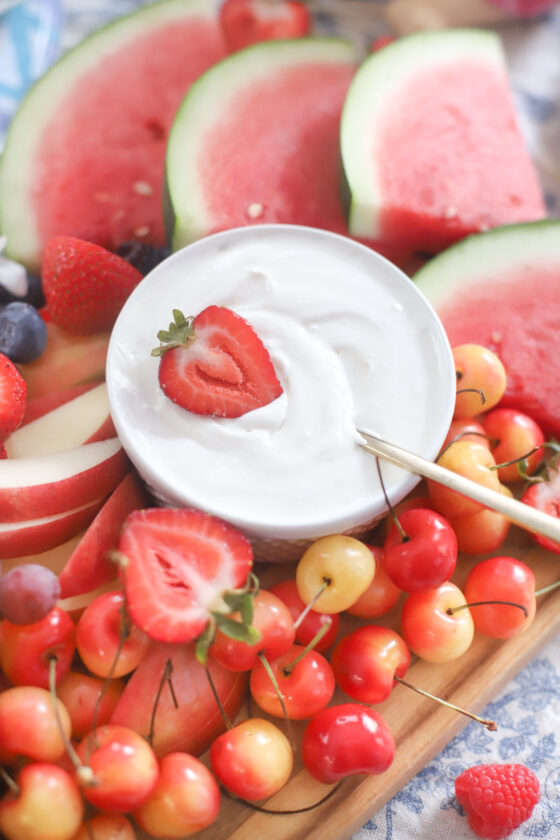Dairy Free Marshmallow Cheesecake Dip and fruits on a board