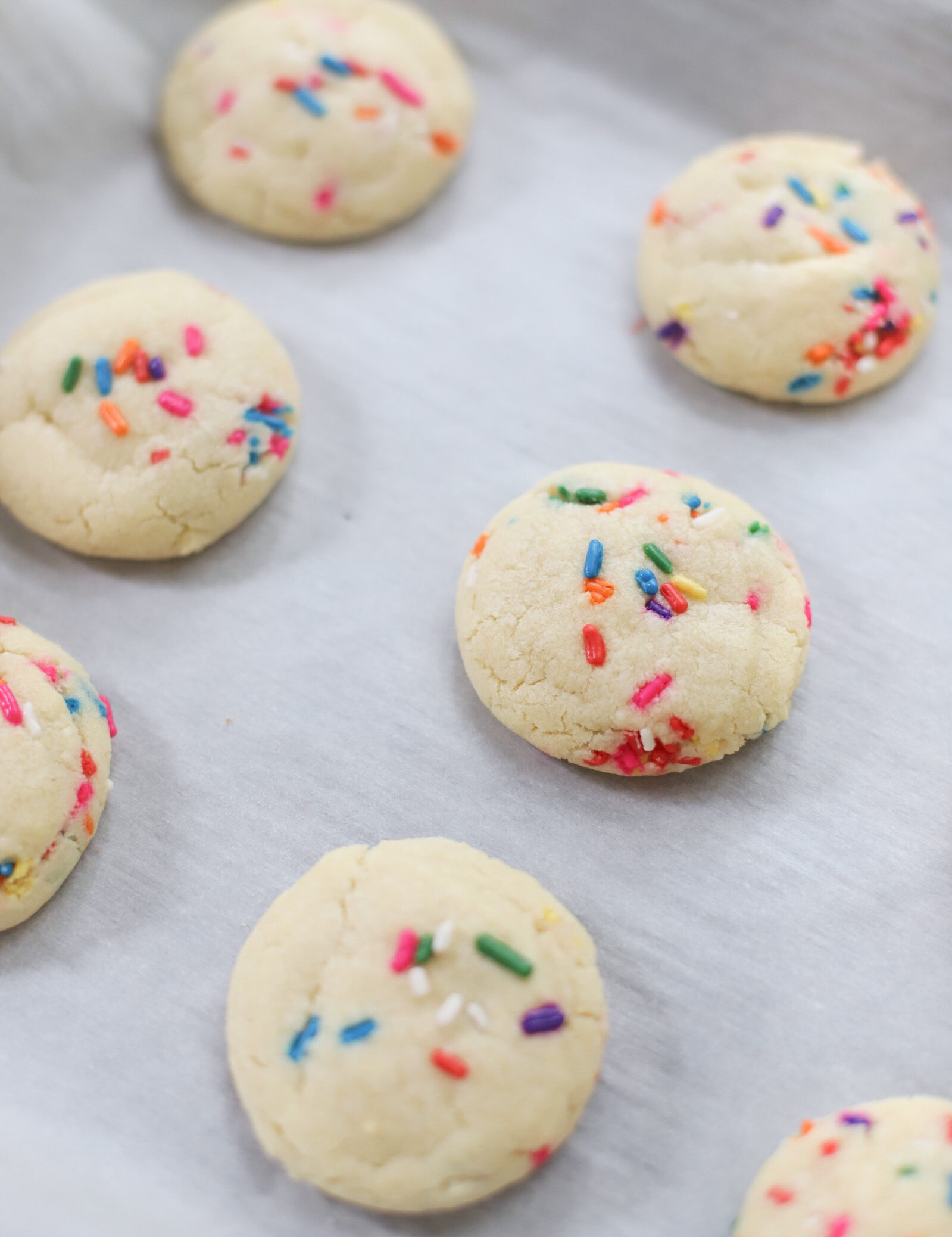 softest sugar cookies with that perfect chewy center, packed with sprinkles