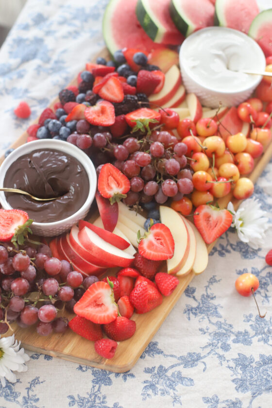 fruits on a board with dips 