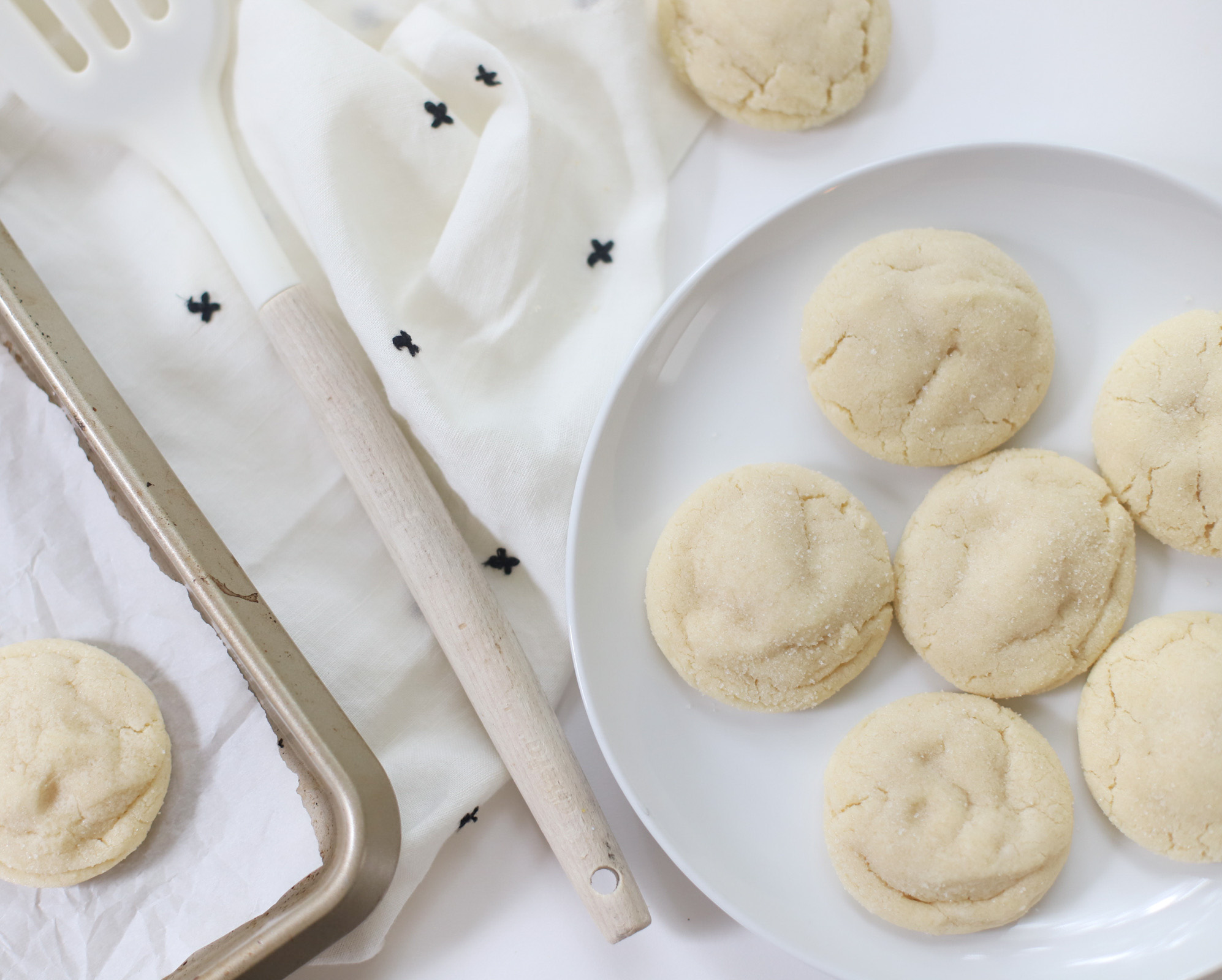 soft Dairy Free Sprinkle Sugar Cookies without sprinkles  on a white plate 