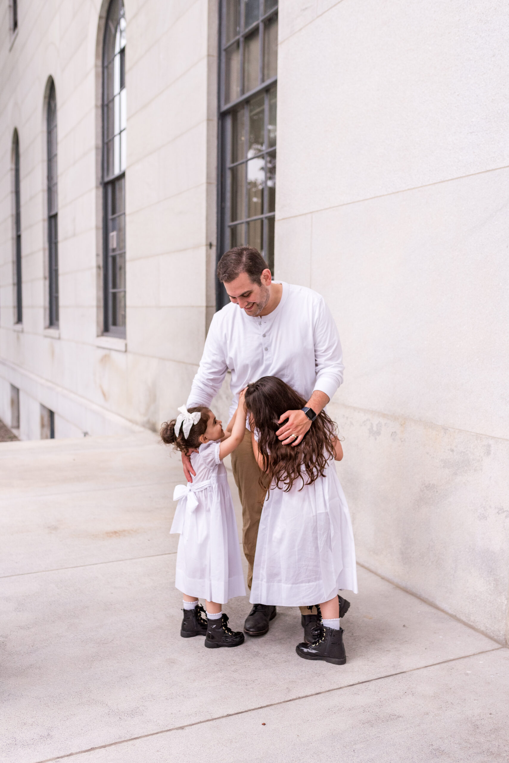 two kids with their father