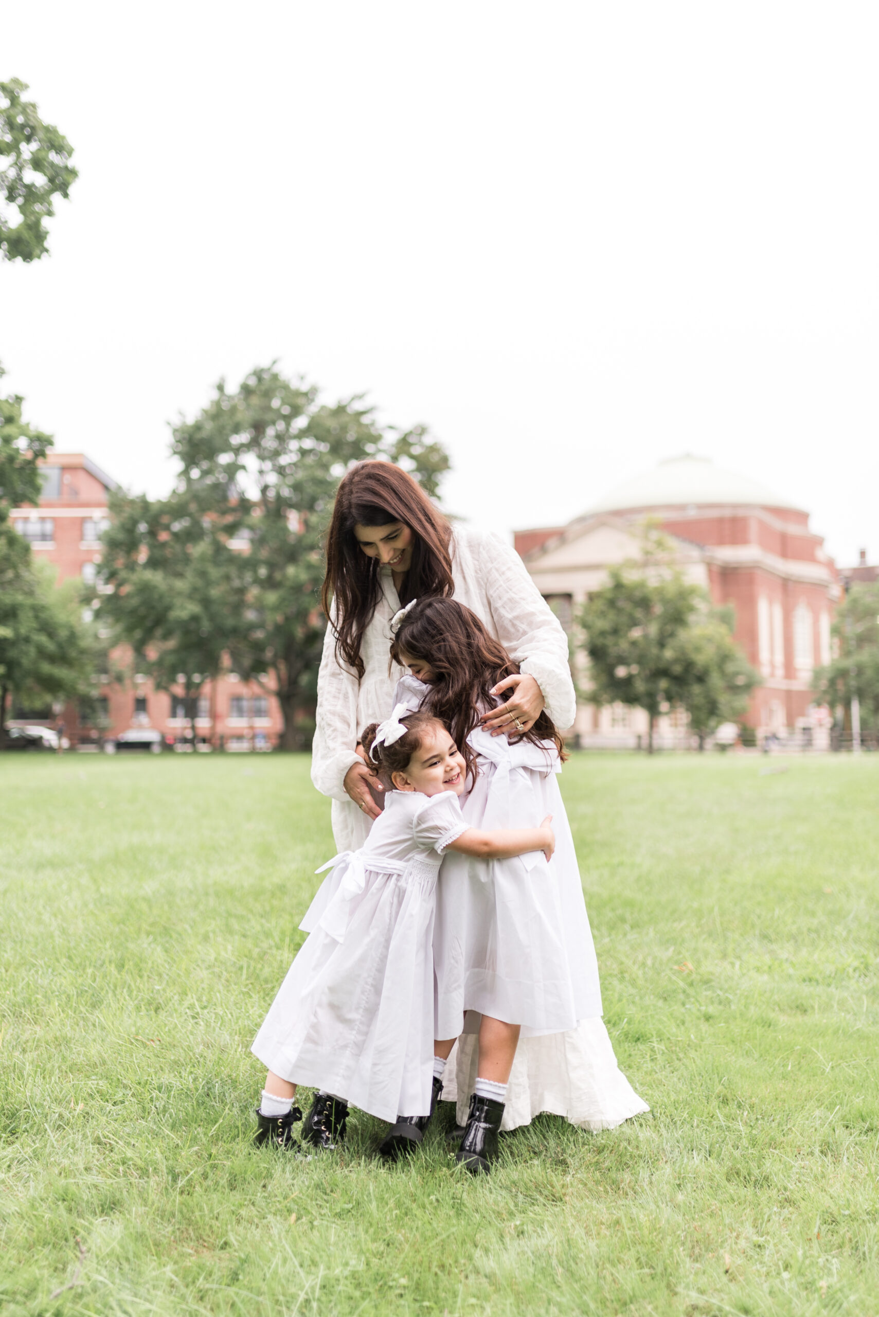 mother with her kids hugging 