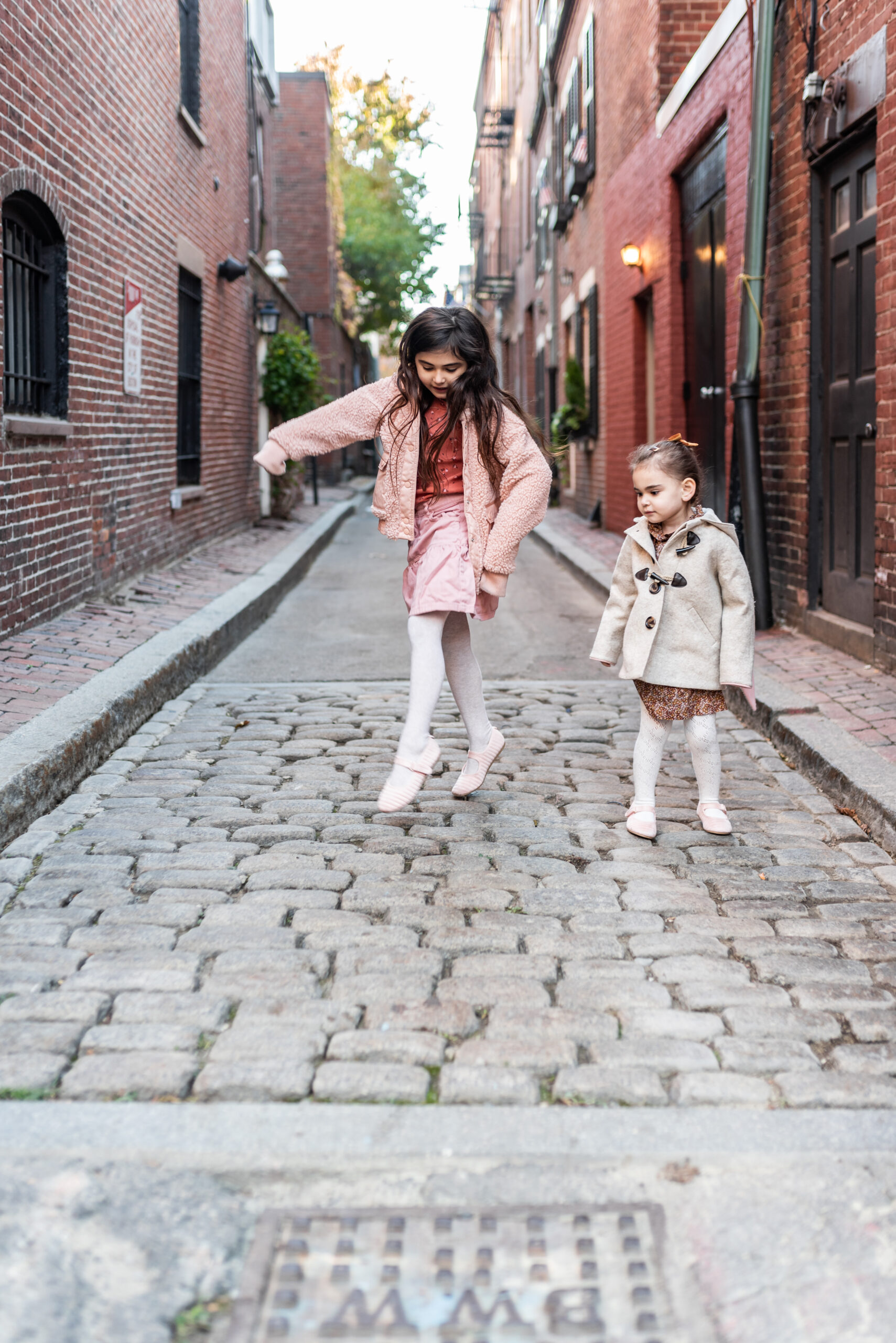 sisters playing in the street 