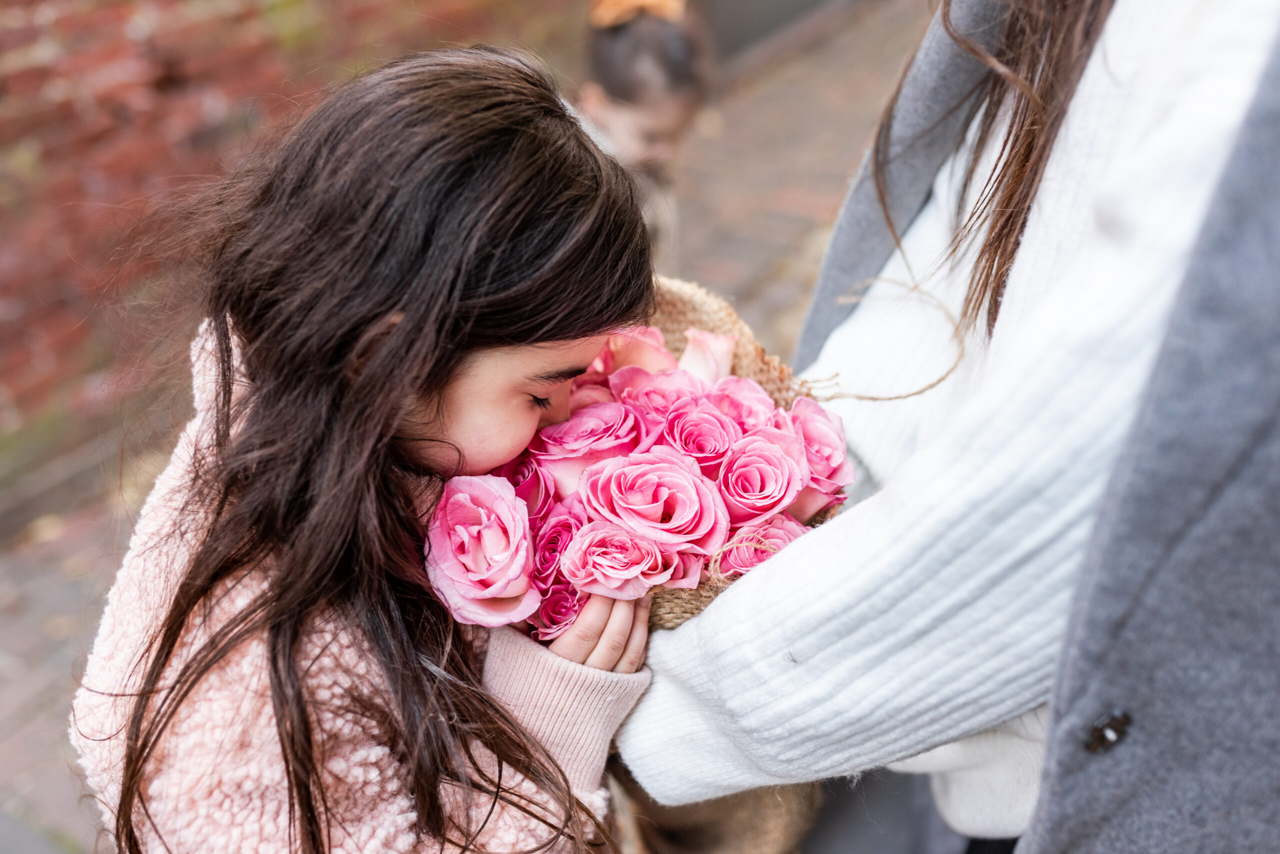 girl smelling flowers 