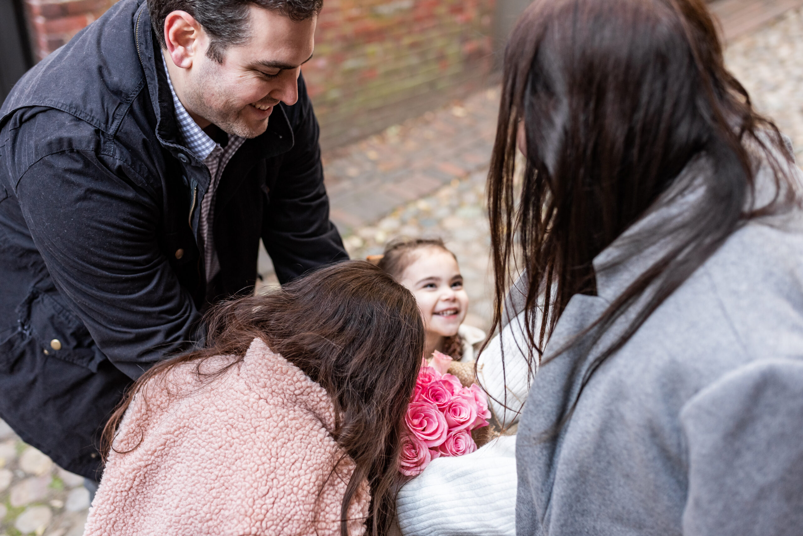 family happy sharing family of four sharing Baby Number 3 Gender Reveal Announcement 