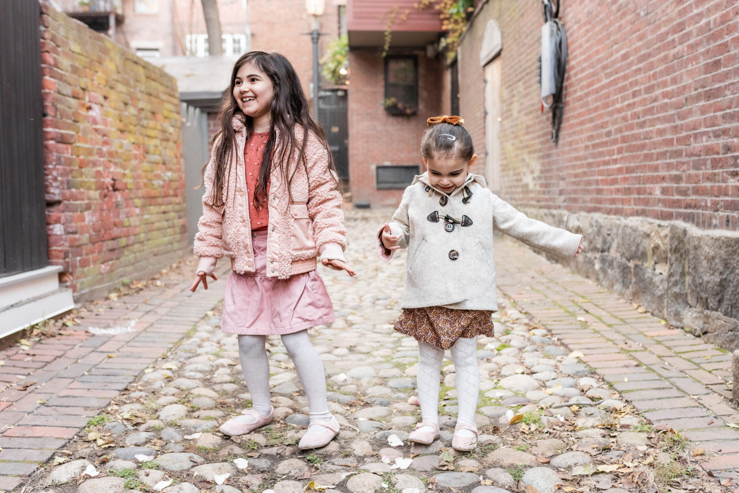 two kids playing outdoors 