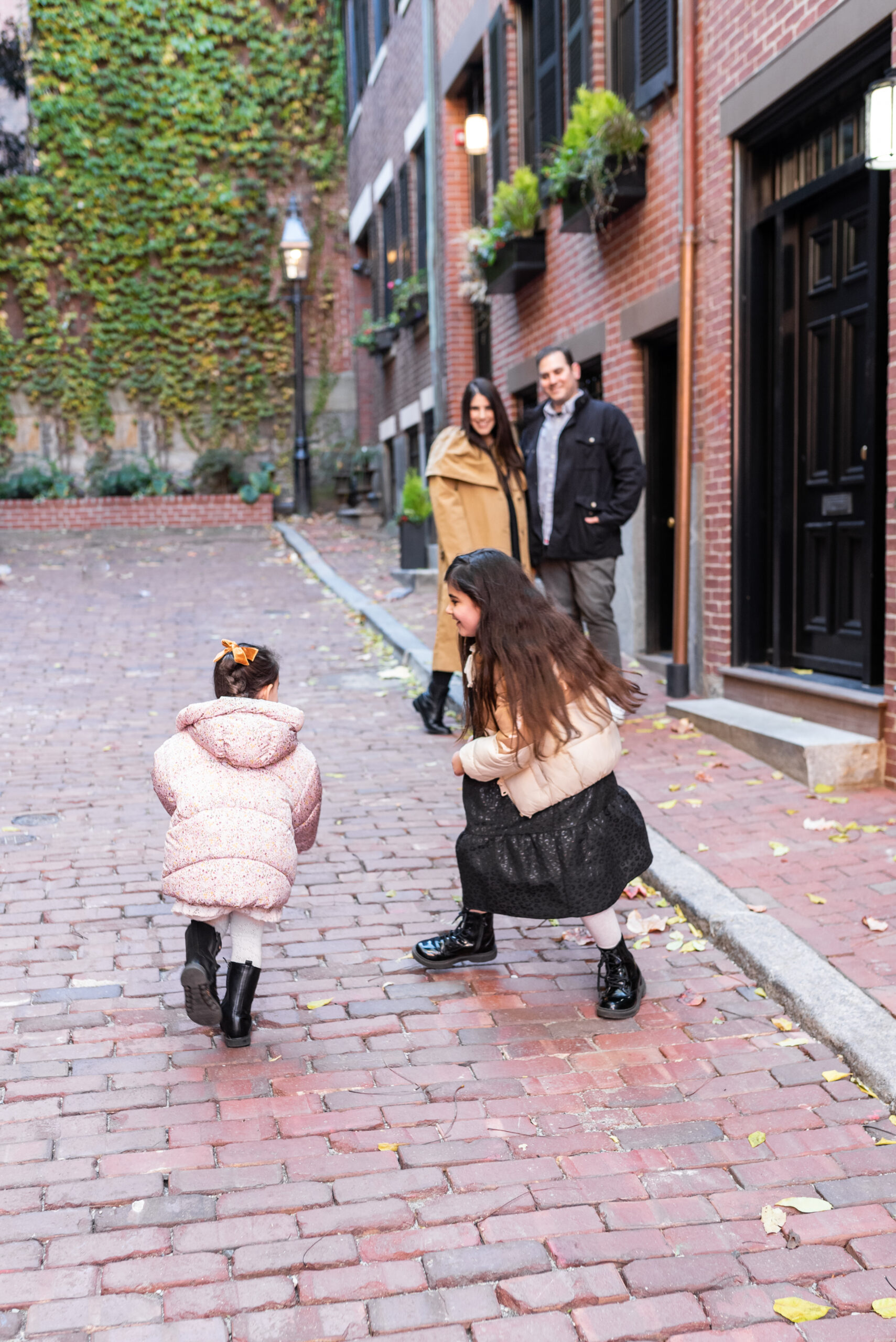 sister and their parents in their Holiday Family Photos in Beacon Hill - Boston