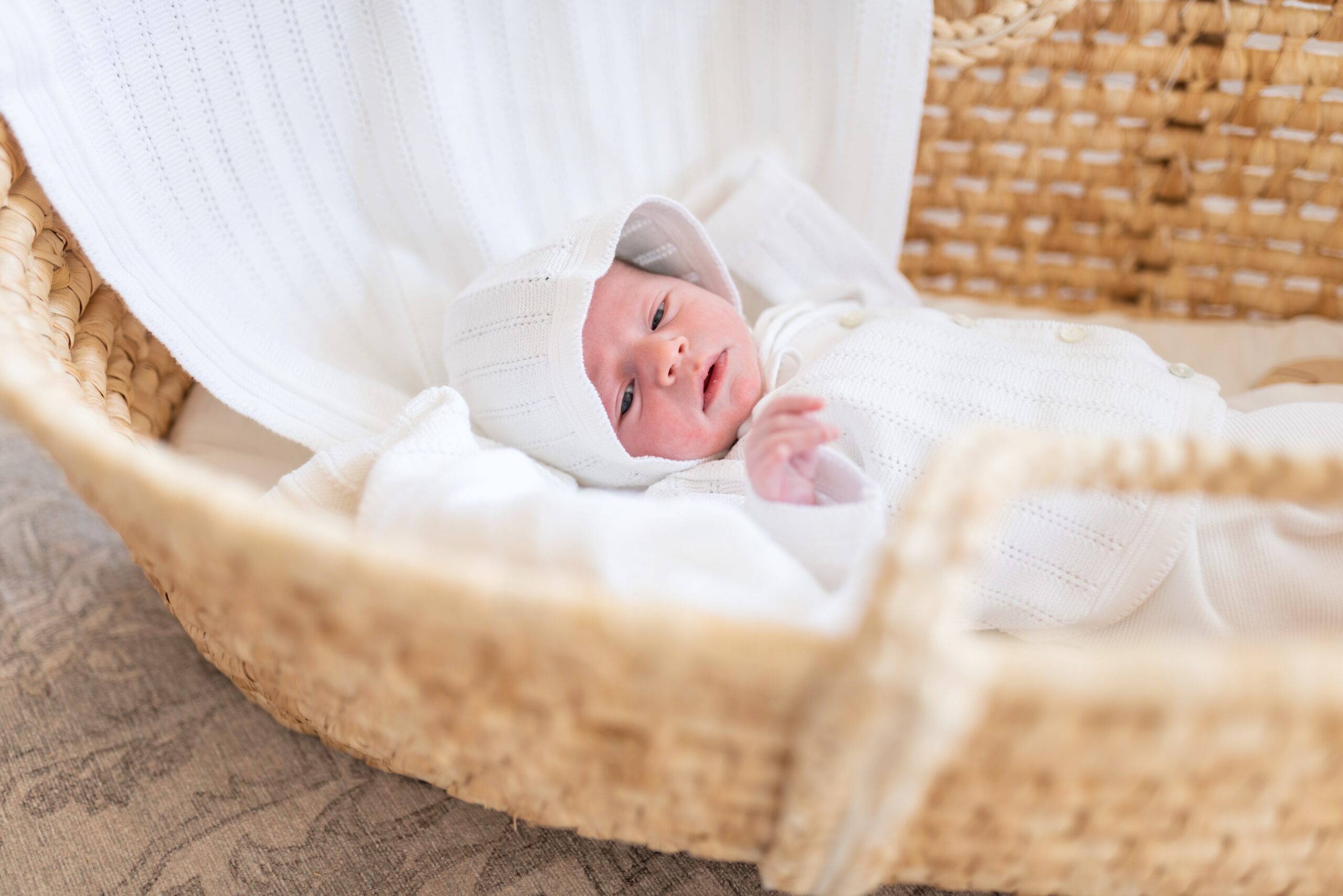 new born in a bassinet