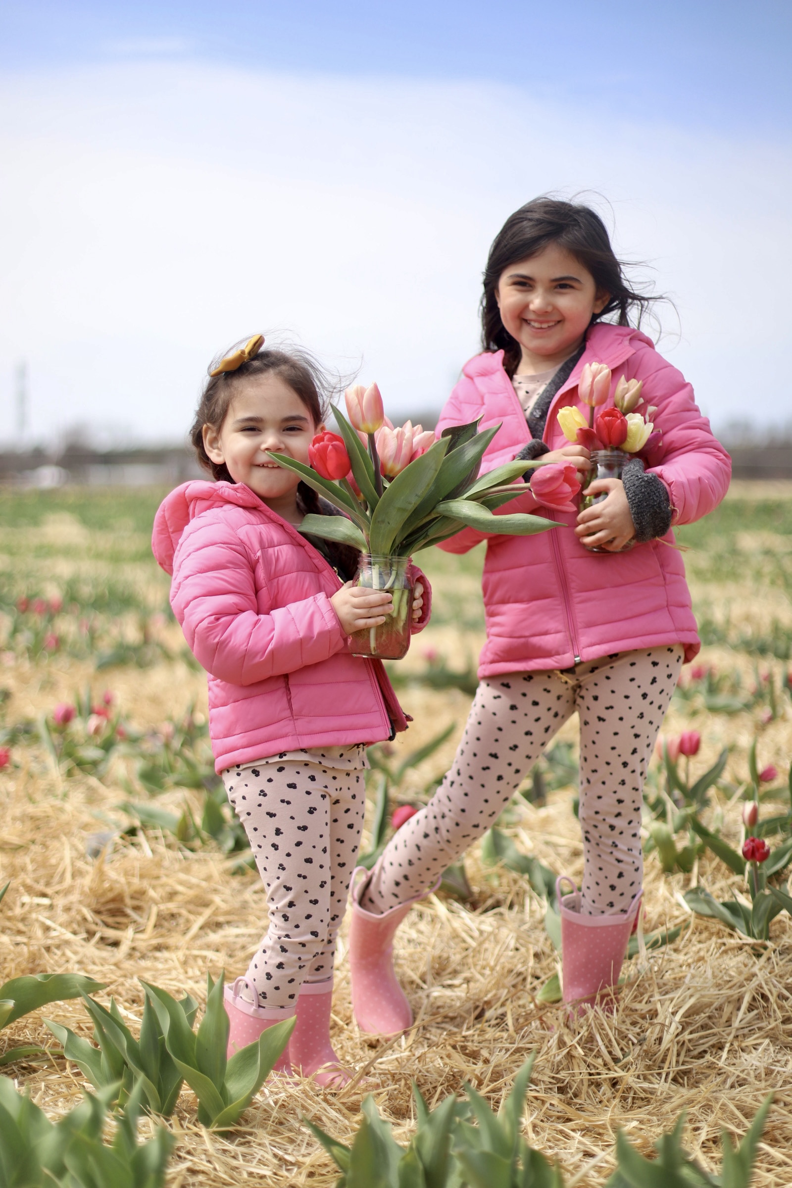 two kids Picking Tulips at Ward’s Berry Farm